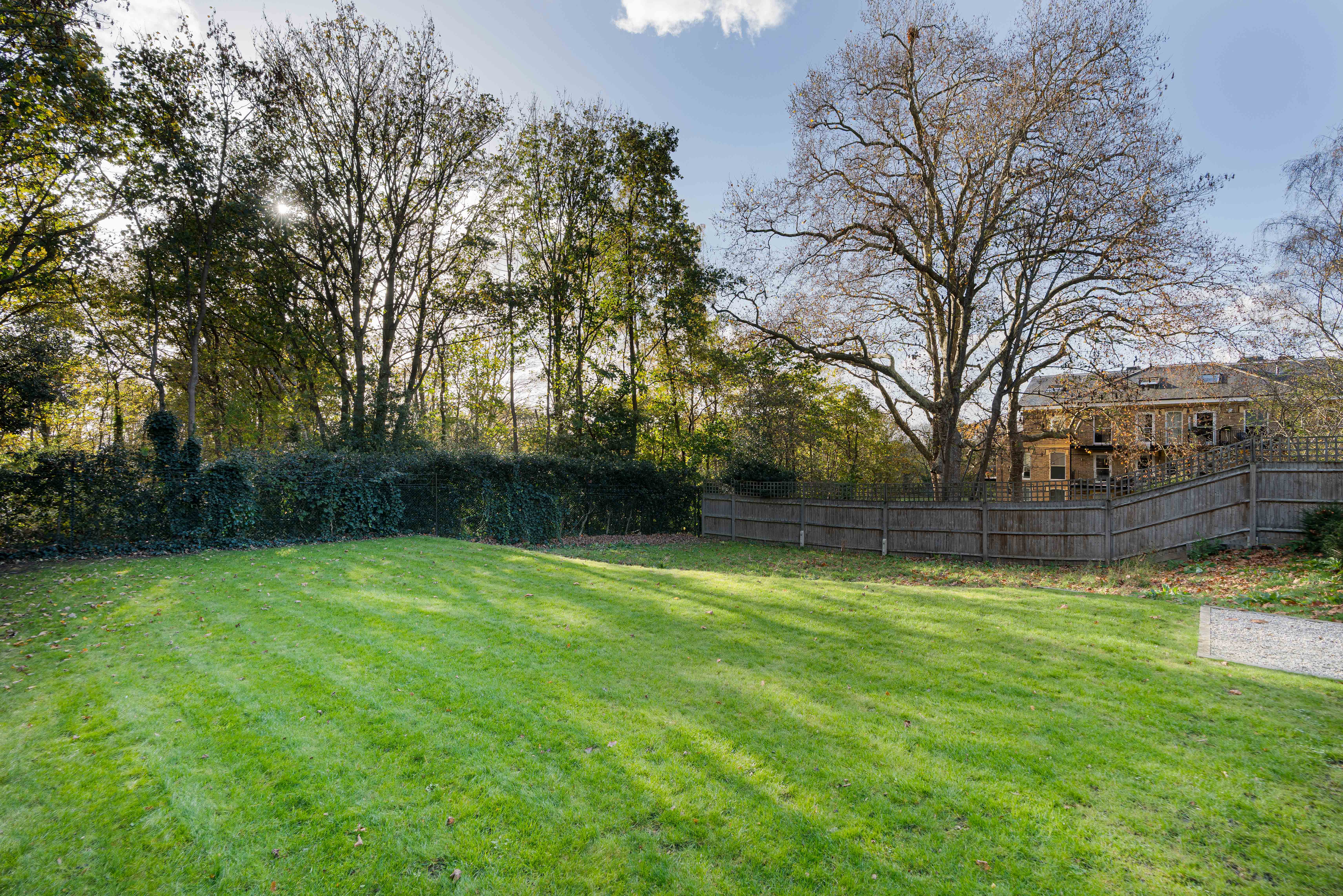 A detached family house on an impressive 0.63 acre plot in a gated Wimbledon set