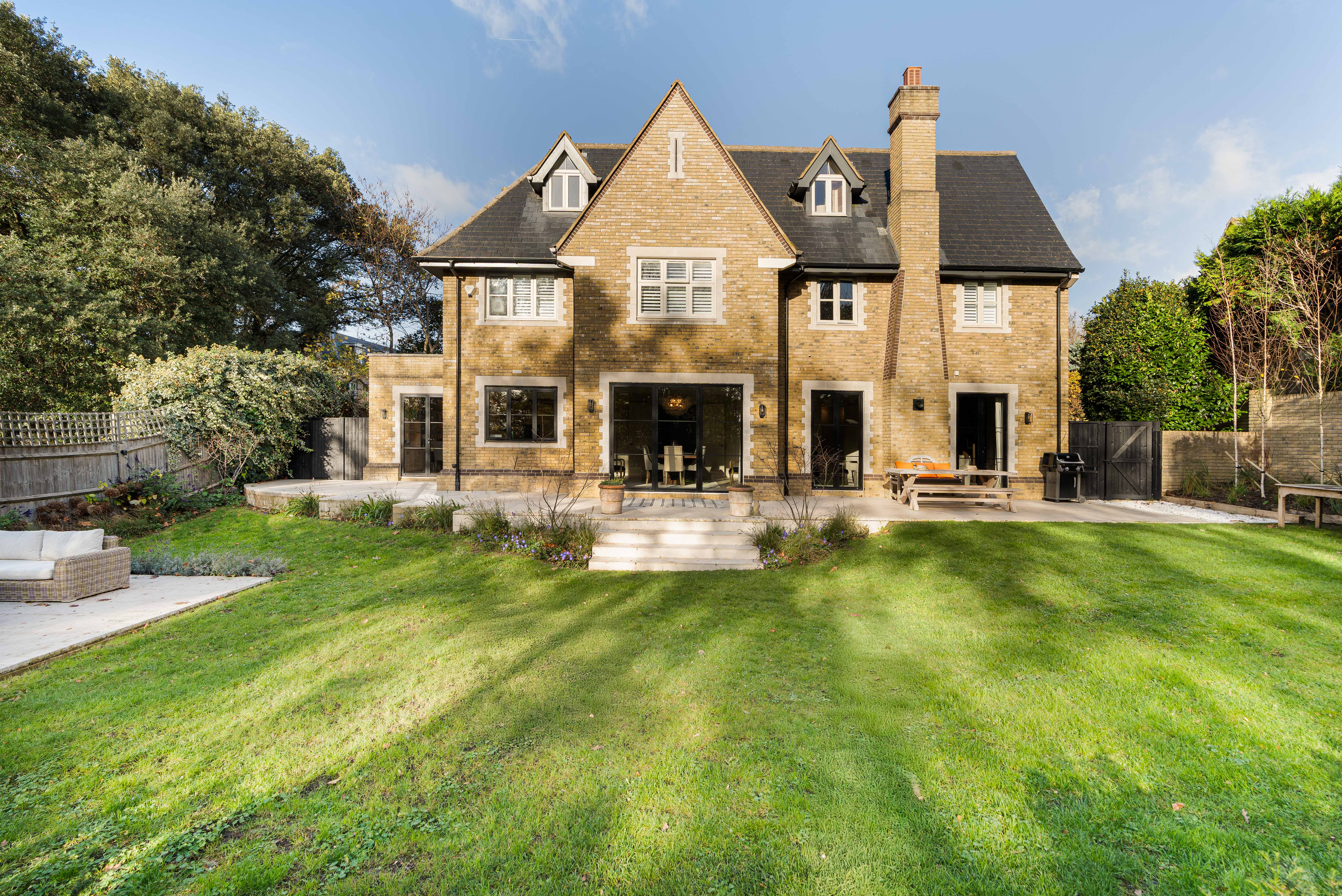 A detached family house on an impressive 0.63 acre plot in a gated Wimbledon set